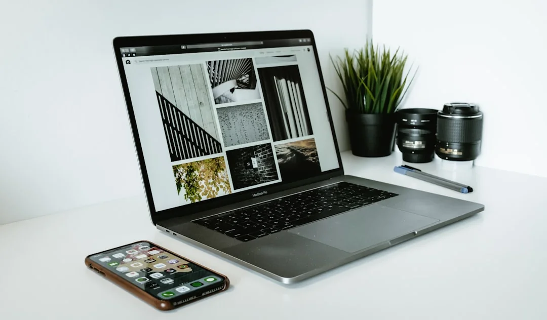 A stylish workspace featuring a laptop and monitors displaying design software.